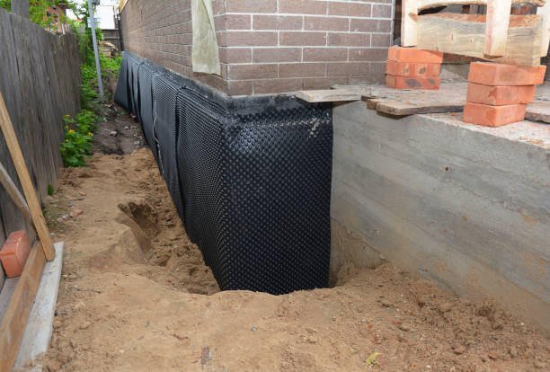 SJ Waterproofing Pros technician performing targeted Waterproofing assessment in Glassboro, NJ
